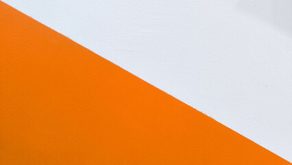 Minimal abstract background featuring a diagonal split of vivid orange and clean white, creating a...