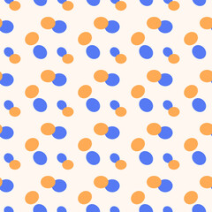 Abstract confetti spotted vector seamless pattern. Simplicity dotted background in blue and orange colors.
