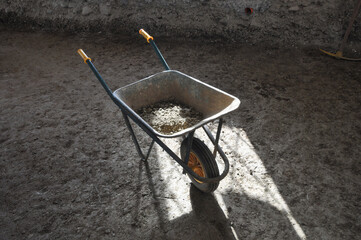 wheelbarrow in building site aka construction site