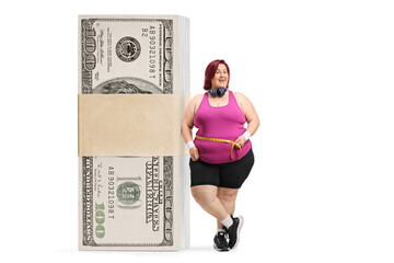 Overweight woman with a measure tape around waist leaning on a stack of money