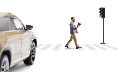 Man with a bunch of red roses crossing a street