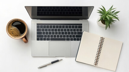 Top view of a minimalist desk setup featuring a laptop, coffee mug, notebook, pen, and a small potted plant for productivity.