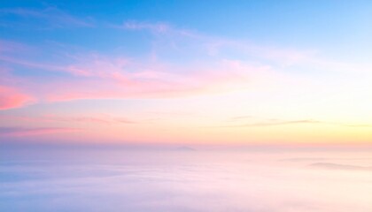 Obraz premium Beautiful Sunrise Sky with Wispy Clouds Over a Misty Landscape Below