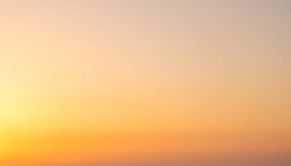 Obraz premium Beautiful Golden Sky With Soft Orange Hues At Sunset