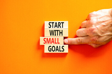 Start with small goals symbol. Concept words phrase Start with small goals on beautiful wooden...