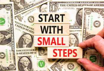 Start with small steps symbol. Concept words phrase Start with small steps on beautiful blocks....