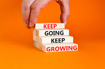 Keep going and growing symbol. Concept words phrase Keep going keep growing on beautiful wooden...