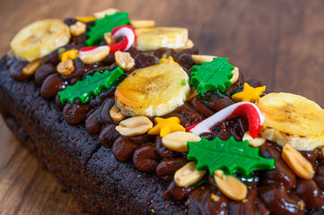 Chocolate banana bread decorated with christmas candy and nuts