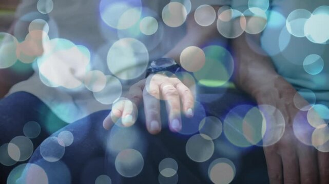 Woman with watch-clad hand extending, hesitating before linking fingers with man for health support