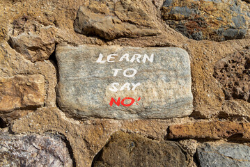 Learn to say no symbol. Concept words phrase Learn to say no on beautiful grey stone wall....