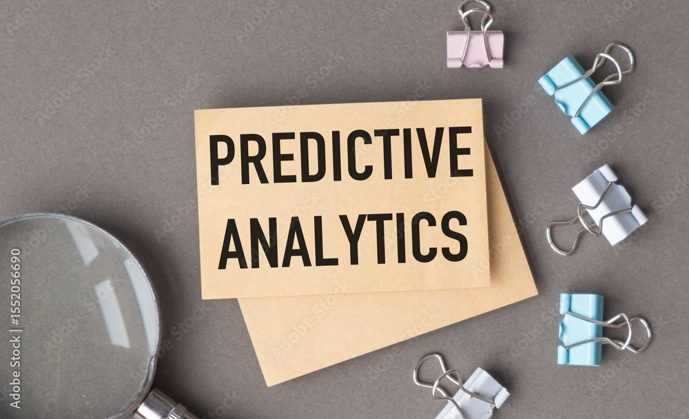 Poster a piece of paper with the word predictive analytics written on it