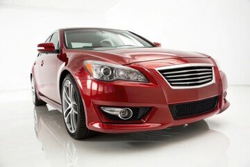 Fototapeta premium Shiny red sedan car front view on a white reflective surface