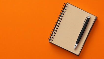 Photo of a notebook and pen on an orange background, symbolizing writing or brainstorming for a copywriting concept. Web banner with copy space on the right side.