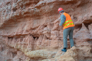 Geologist surveying mine,Explorers collect soil samples to look for minerals, A geologist is a...