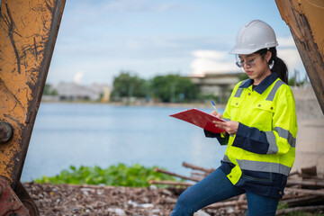 Environmental engineers work at the water storage plant, check the pH of the water, check the...