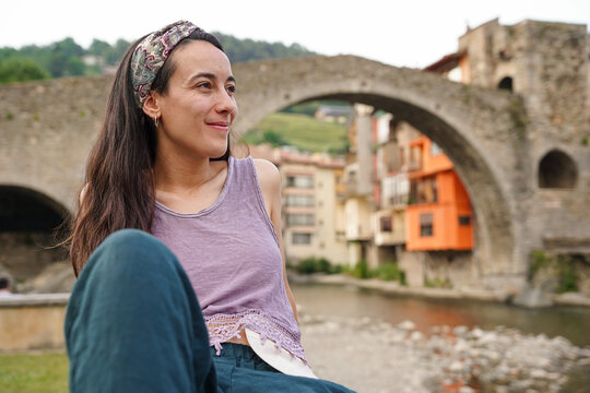 HAppy woman with ostomy in a medieval village. World Cancer Day
