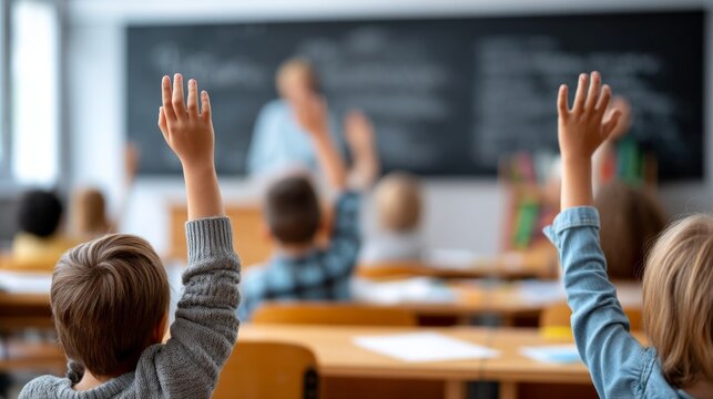 A classroom with students raising their hands and a teacher in front of a blackboard. Scene is one of learning and engagement