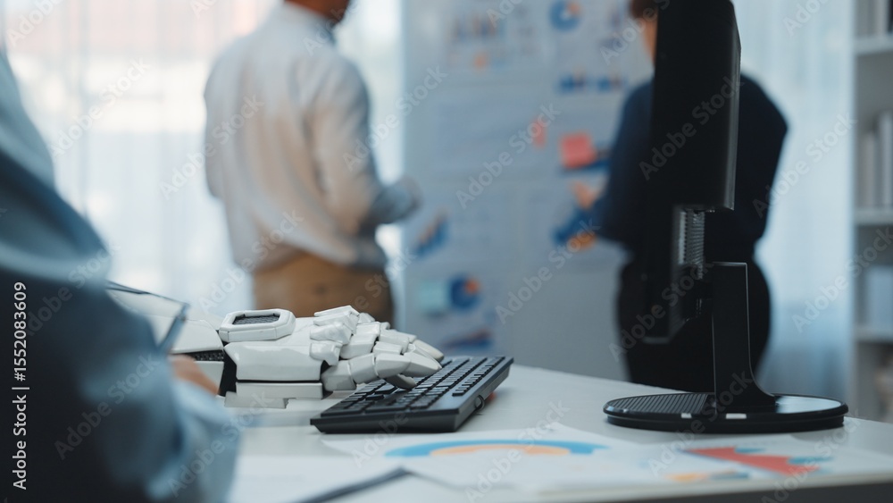 Poster a modern office scene showcasing a robotic hand on a keyboard while professionals engage in chart an