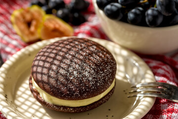 Whoopie pie with orange cream. Delicious homemade dessert.