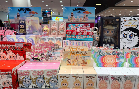 Dubai, UAE - June 22, 2025: Pop Mart blind box toys featuring various Labubu figures on display in a trendy toy store. Labubu collectibles are popular, viral on TikTok, and loved by toy fans