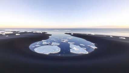 Icebergs Floating in Lagoon on Black Sand Beach
