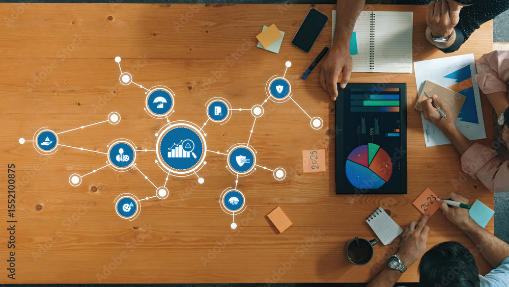 Aufkleber a top-down view of a collaborative meeting with professionals analyzing data visualizations and disc