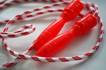 Jump rope on white background, top view