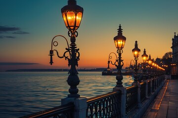 Waterfront Path: Illuminated vintage lampposts glow along ocean promenade at sunset