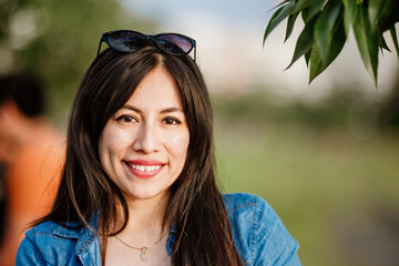 Portrait of a young woman in a park
