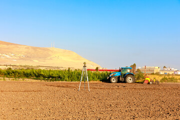 Soil leveling tractor working in the field