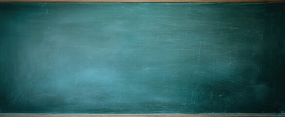 The empty chalkboard in an educational classroom setting.
