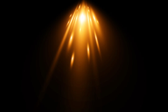 spotlight on stage or gold rays isolated on black background