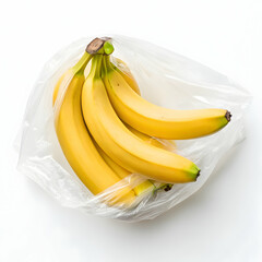 Bunch of yellow bananas inside a clear plastic bag on a white background, top view overhead shot for grocery, food waste, eco concept.