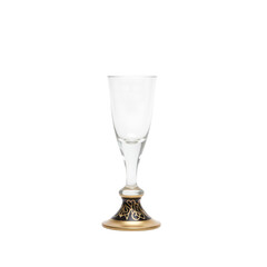 Obraz premium Elegant glass shot glass with decorative golden base 