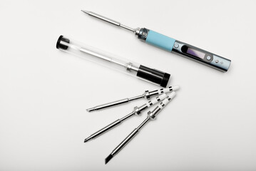 New electronic soldering irons with stingers. Modern tin soldering tools.