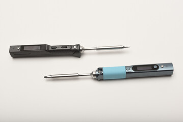 New electronic soldering irons with stingers. Modern tin soldering tools.