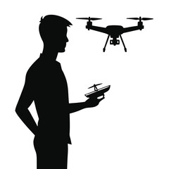 Silhouette of man holding drone controller with drone in air