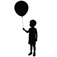 Silhouette of a young boy holding a black balloon child