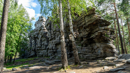 Devil's Hillfort complex on sunny summer day. Iset Park, Iset village, Sverdlovsk region, Russia. Hiking and walking