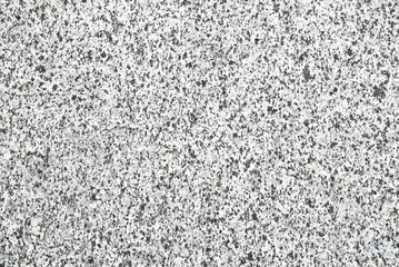 Light gray granite texture with small inclusions. Minimalistic background for various projects.