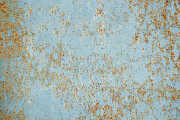 Abstract background. Texture of old, rusty metal with peeling blue paint.