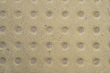 dirty yellow surface with round protrusions