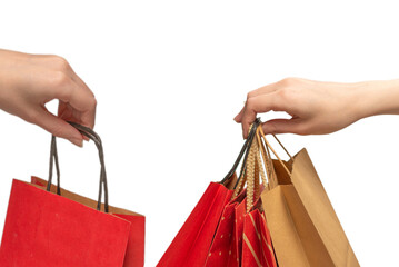 Paper bag in woman hands isolated on white background.