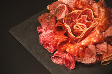 Different kinds of meat cuts on a board.