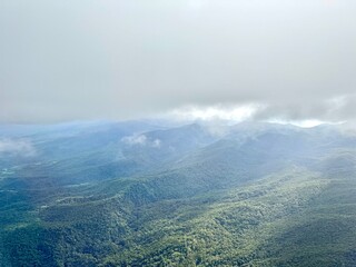 flight over Guadeloupe with a view of green mountains
