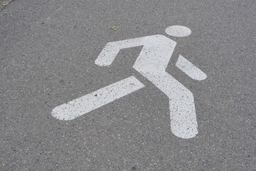 White painted markings for pedestrian and bicycle paths on the street