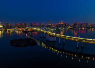 Tokyo and Rainbow Bridge at sunrise from Air
