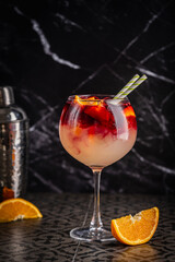 Glass of red wine spanish famous traditional fruity sangria gourmet cocktail or vino de verano, tinto de verano drink. High quality photo
