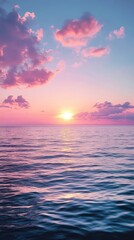Obraz premium A serene sunset over a calm ocean.