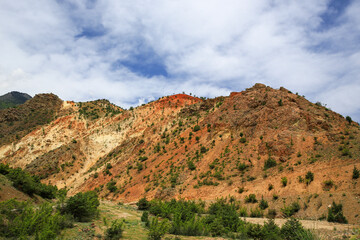 Footage of colorful rock formations lined up in layers.